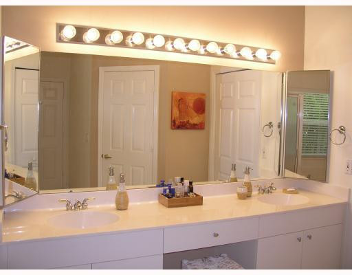12314 Melrose Way Boca Raton, FL 33428 - Photo 9 of 12 a bathroom with a sink and a mirror