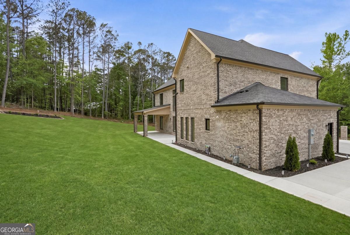 1557 Whitley Road Dacula, GA 30019 - Photo 41 of 46 a view of a house with a yard