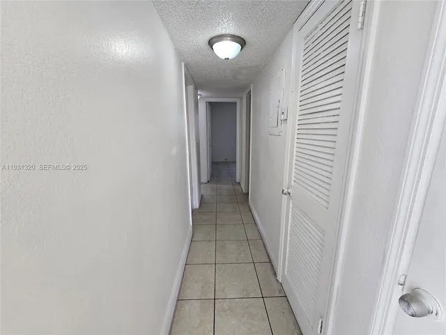 a view of a hallway with a white door