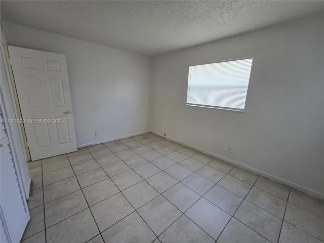 a view of a room that has a window in it