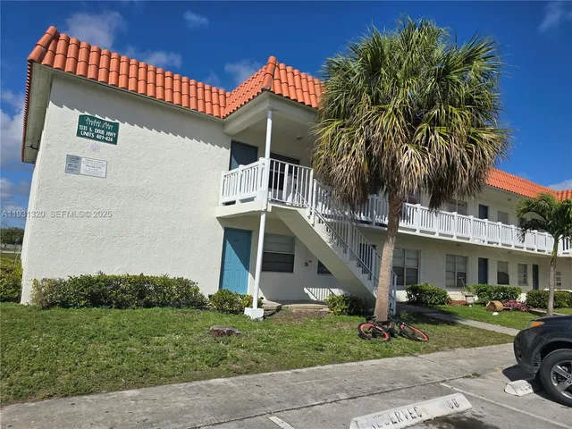 a view of a cars parked in front of a building