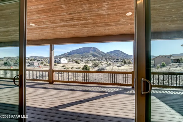 a view of a balcony with wooden floor
