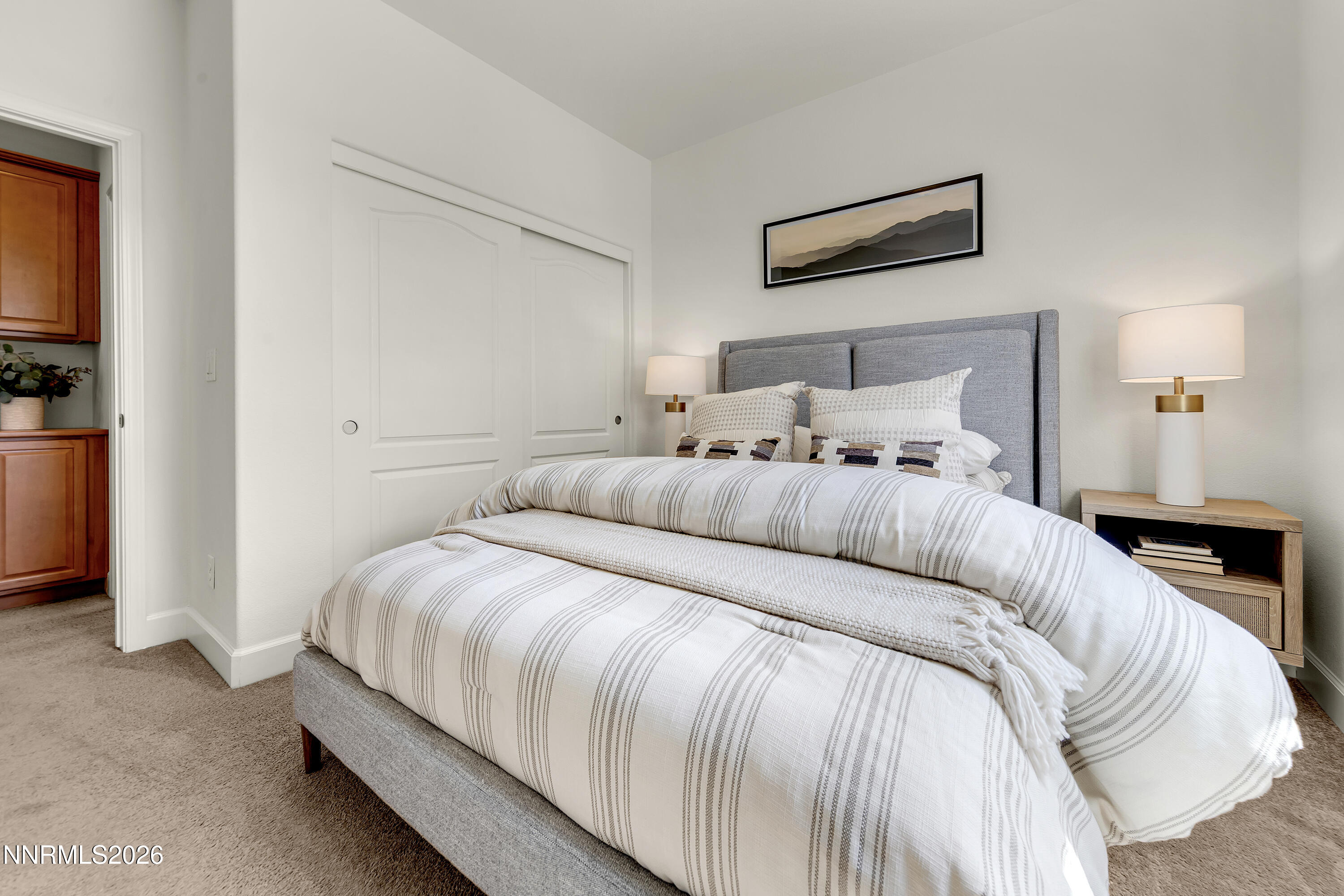 10150 Barrel Racer Drive Reno, NV 89521 - Photo 23 of 64 a bedroom with a bed and a lamp