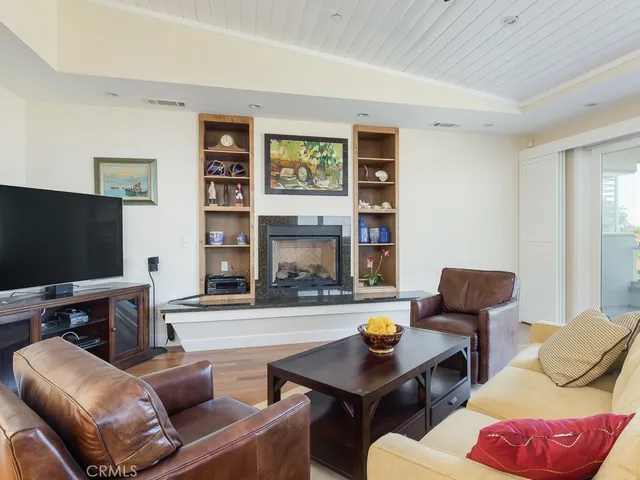 a view of a porch with furniture and next to a yard