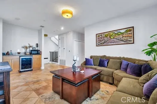 a living room with furniture and a clock