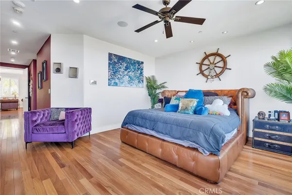 a bedroom with a bed and dresser