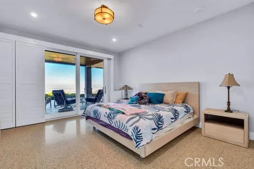 a bedroom with a bed and a table