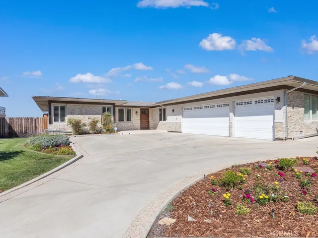 a view of a house with a street