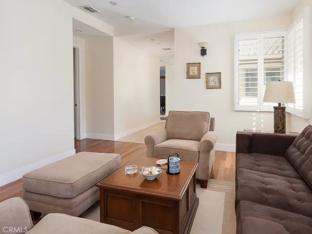 a bedroom with a bed and glass door