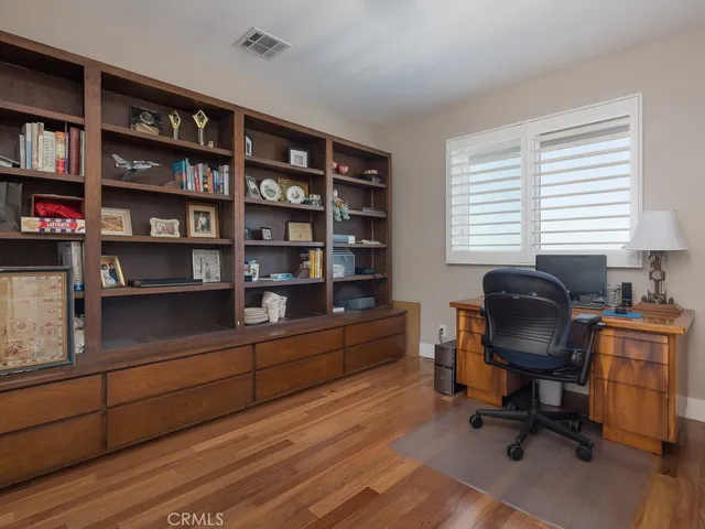 a kitchen with white cabinets and a sink