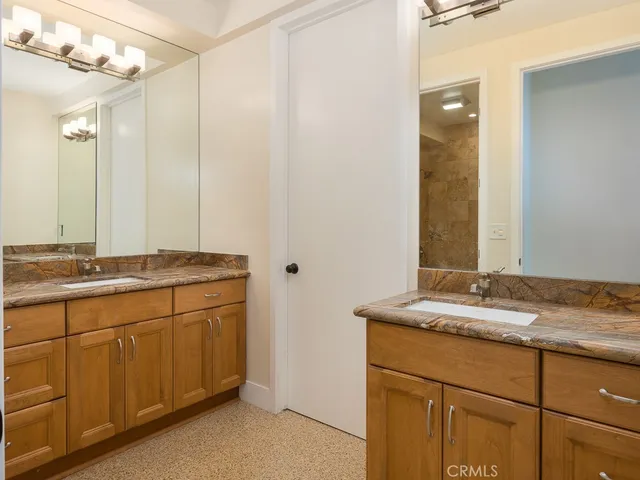 an aerial view of a houses with a city