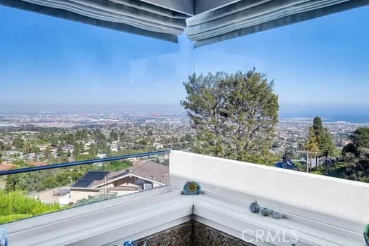a view of a balcony with city view