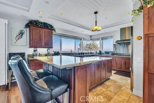 a kitchen with granite countertop a sink appliances and cabinets