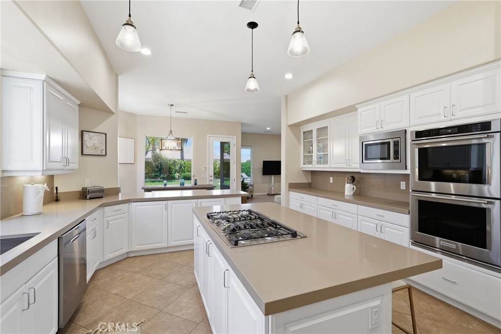 9 Orleans Road Rancho Mirage, CA 92270 - Photo 20 of 71 a kitchen with a sink a stove and oven
