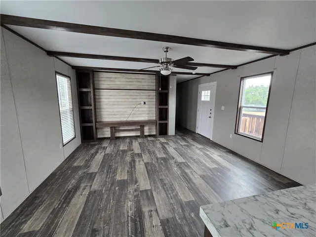 a view of a room with wooden floor and closet