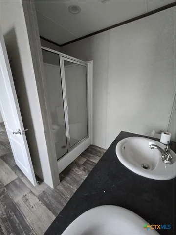 a bathroom with a sink and mirror