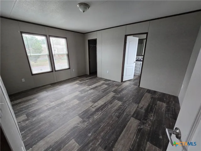 an empty room with windows