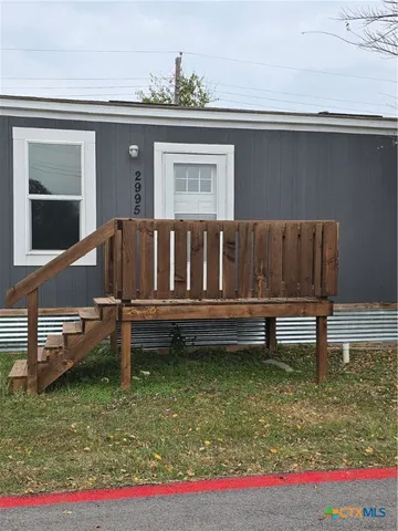 a house view with a garden space