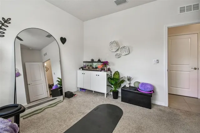 a kitchen with kitchen island a counter top space a sink and cabinets