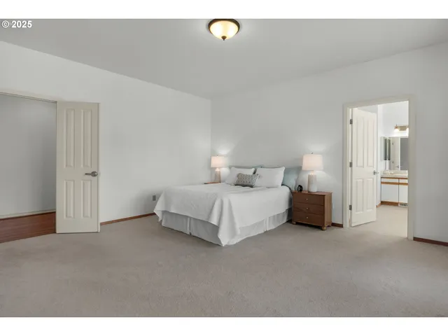 a bed room with a bed and a night stand