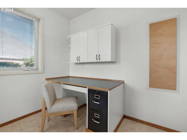 a kitchen with a table and chair