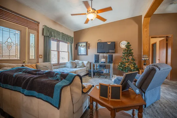 a kitchen with stainless steel appliances granite countertop a sink a stove cabinets and a refrigerator