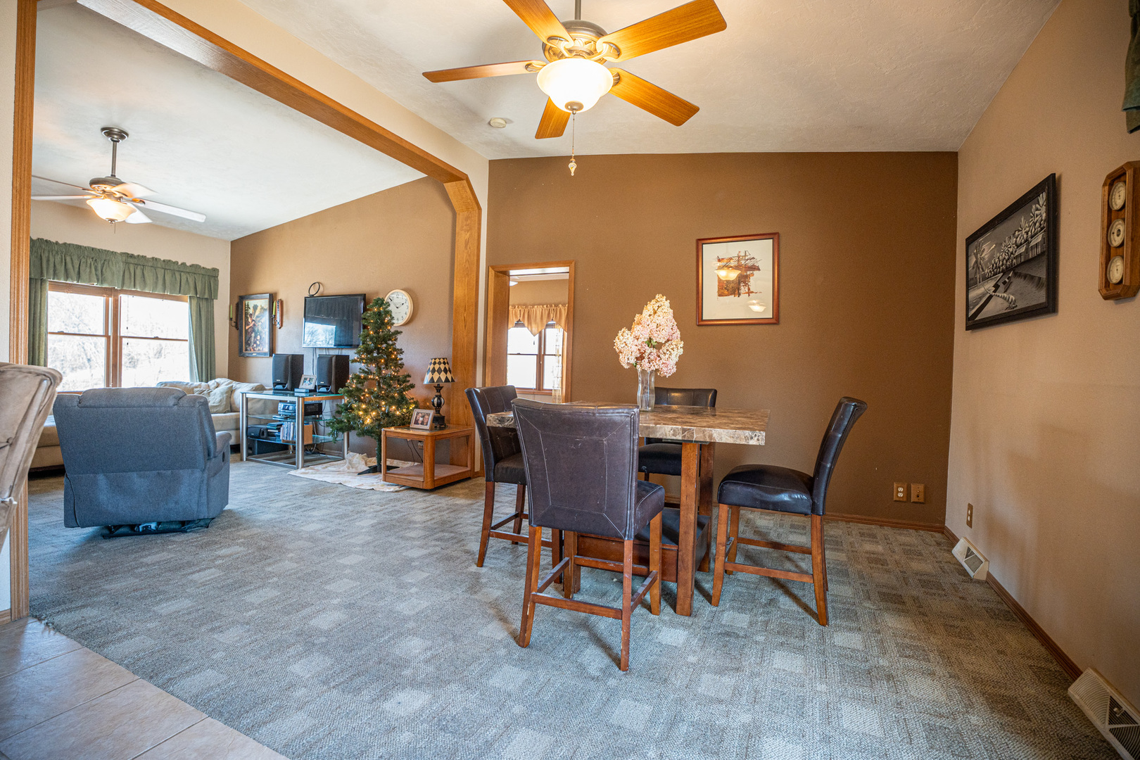 9304 Ellis Road Fenton, IL 61251 - Photo 19 of 81 a view of a dining room with furniture and a chandelier