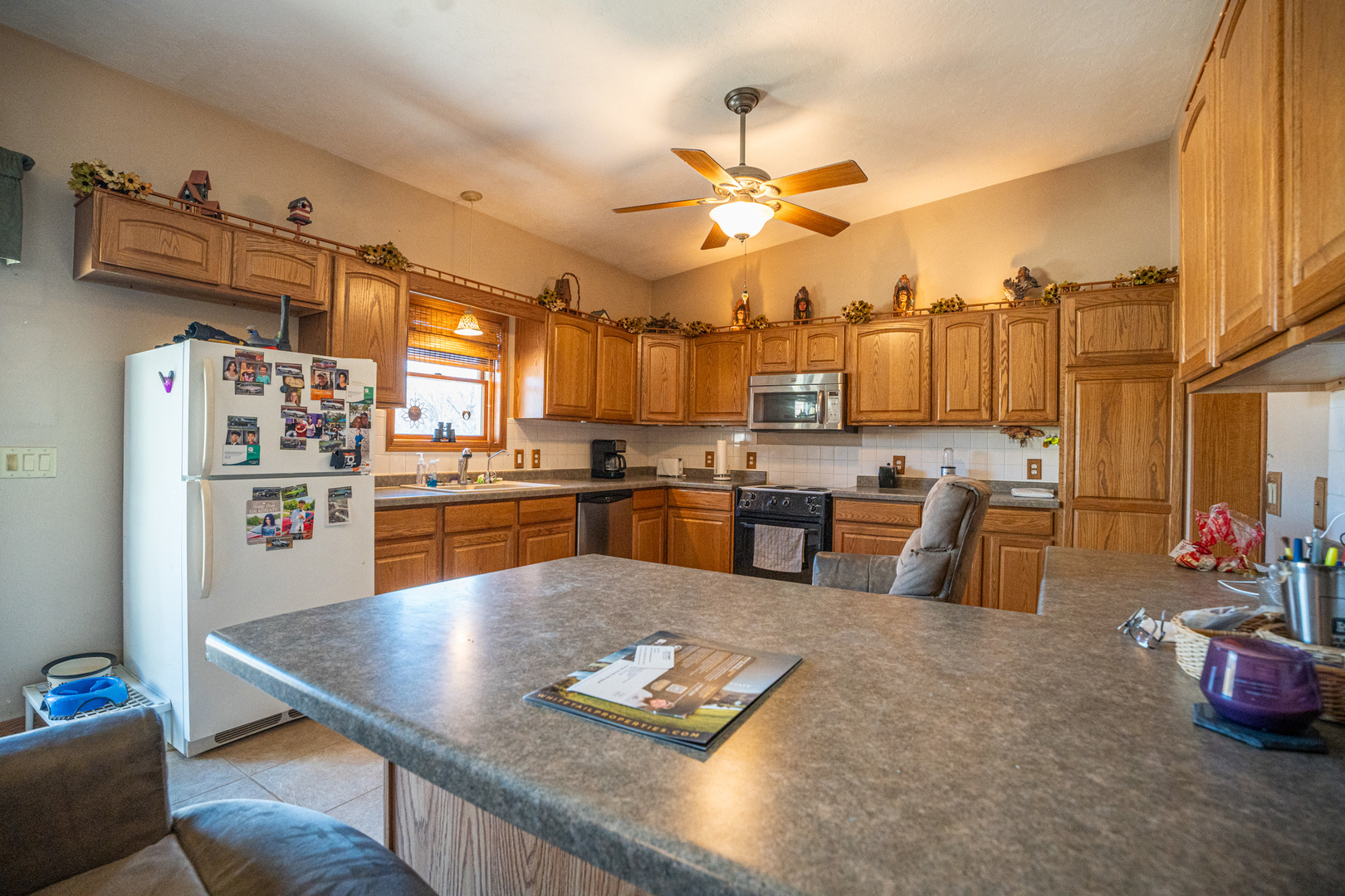 9304 Ellis Road Fenton, IL 61251 - Photo 21 of 81 a living room with lots of furniture and kitchen view