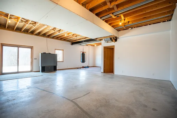 a view of a storage room with wooden floor