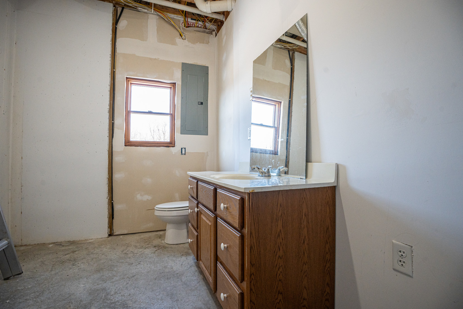9304 Ellis Road Fenton, IL 61251 - Photo 46 of 81 a bathroom with a toilet sink and mirror