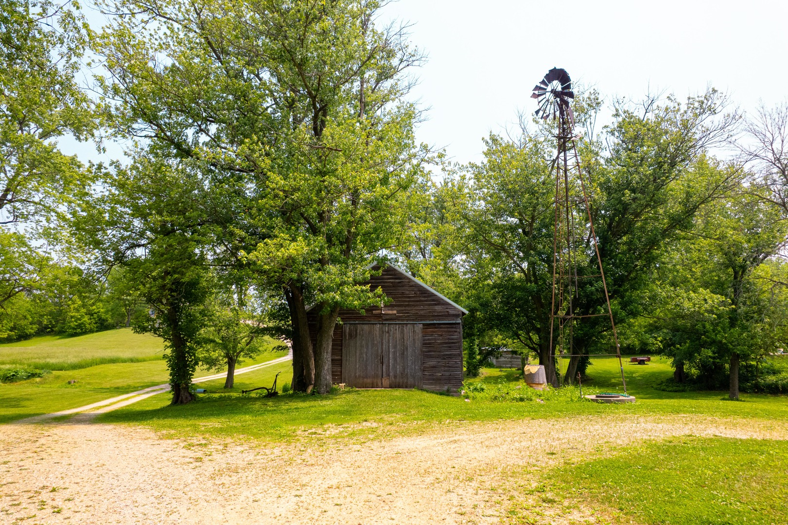 9304 Ellis Road Fenton, IL 61251 - Photo 54 of 81 a backyard of a house with a yard and large tree