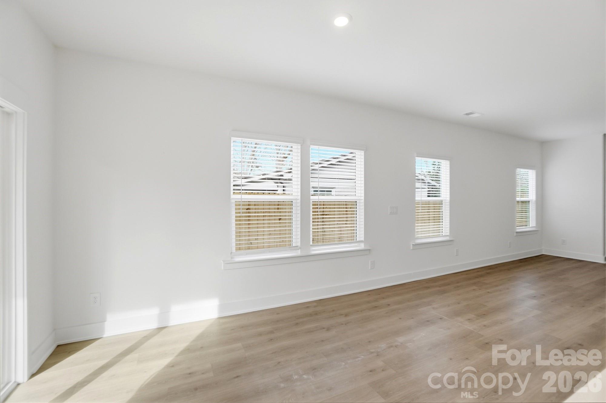 3945 Tillman Road Charlotte, NC 28208 - Photo 13 of 47 an empty room with windows