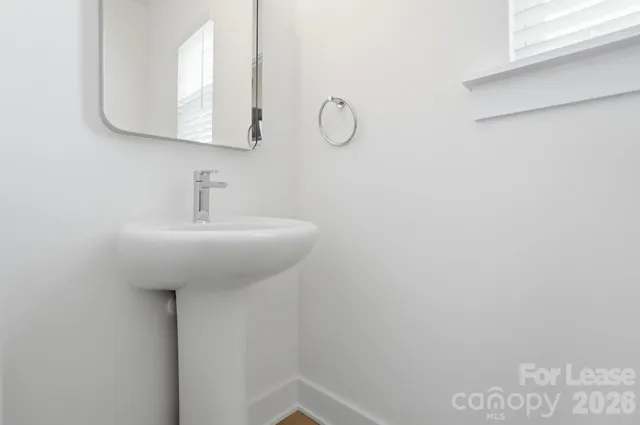 a bathroom with a sink and mirror