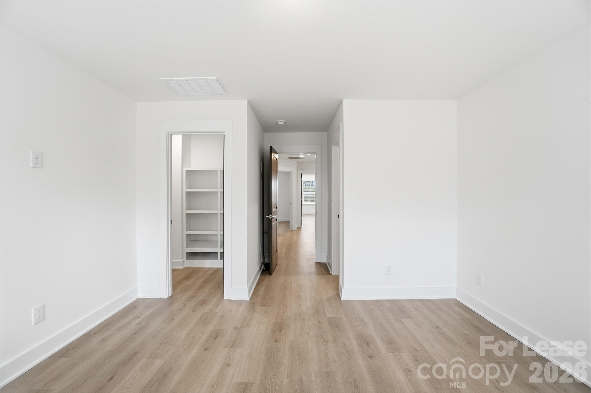 3945 Tillman Road Charlotte, NC 28208 - Photo 26 of 47 a view of empty room with wooden floor