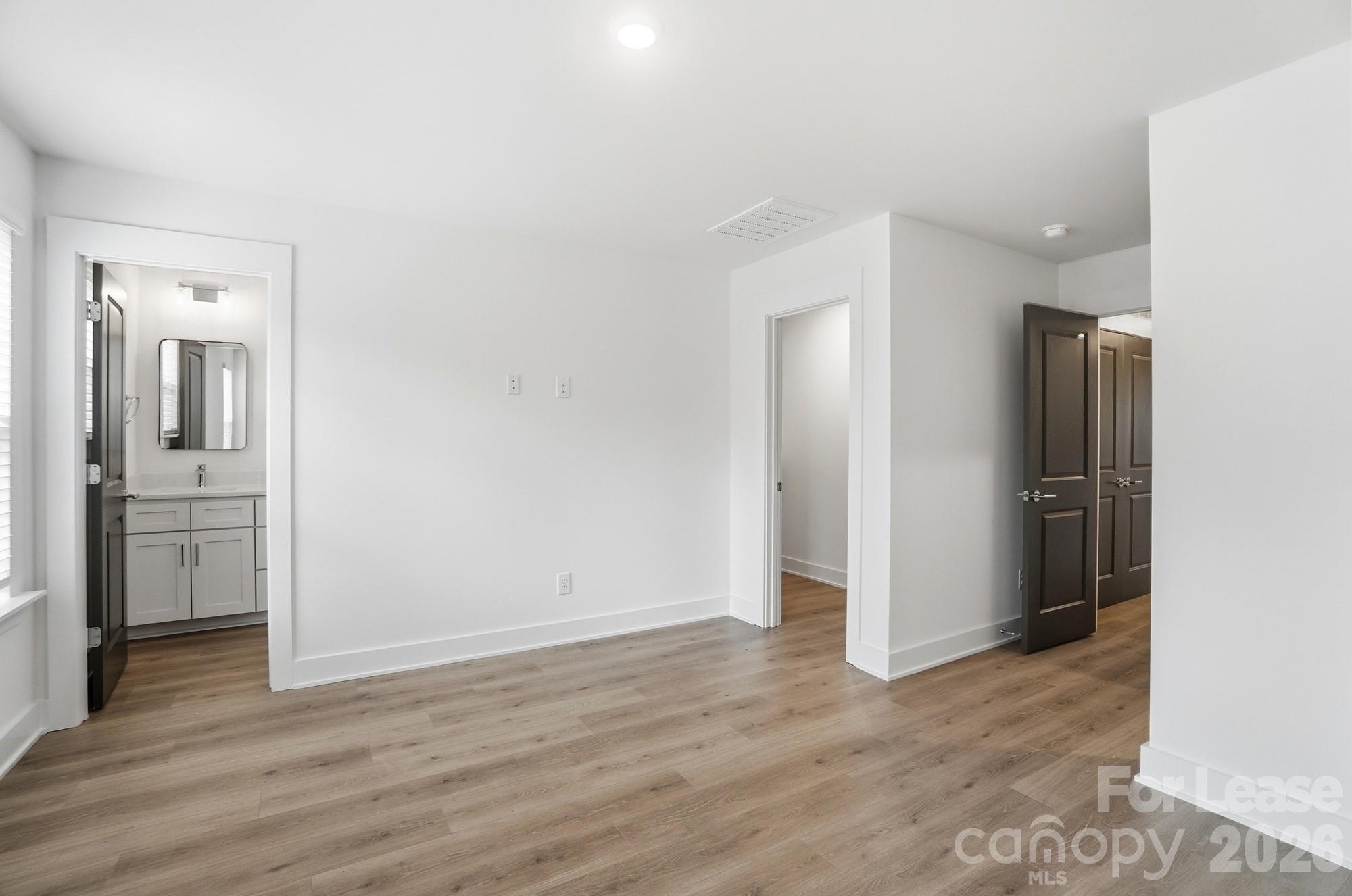 3945 Tillman Road Charlotte, NC 28208 - Photo 27 of 47 a view of a hallway with wooden floor