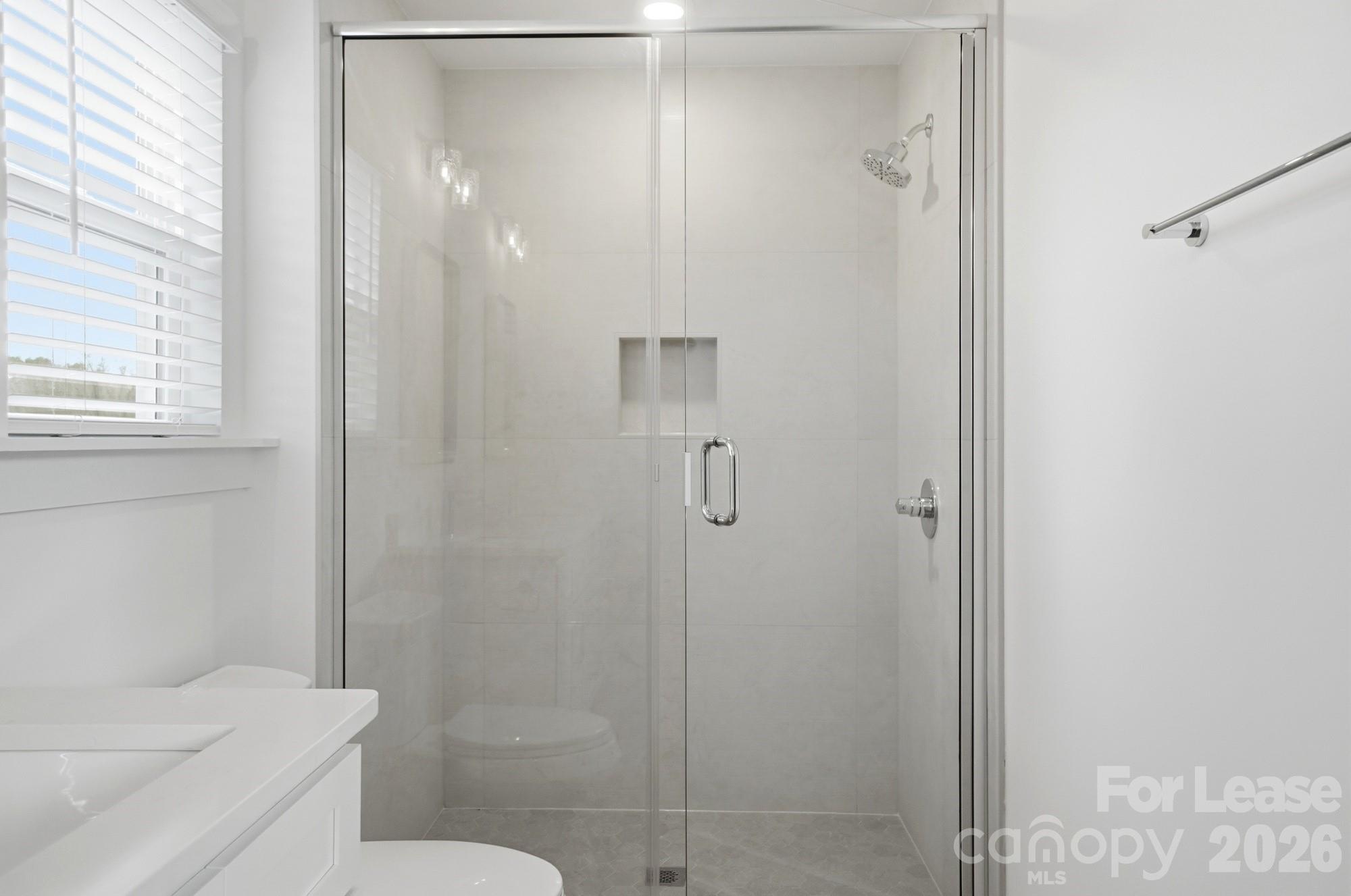 3945 Tillman Road Charlotte, NC 28208 - Photo 30 of 47 a bathroom with a shower and toilet