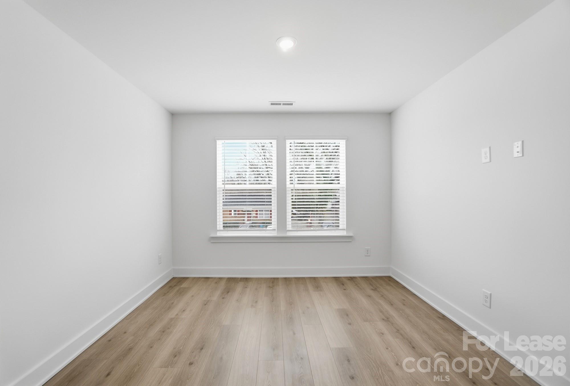 3945 Tillman Road Charlotte, NC 28208 - Photo 33 of 47 an empty room with a window