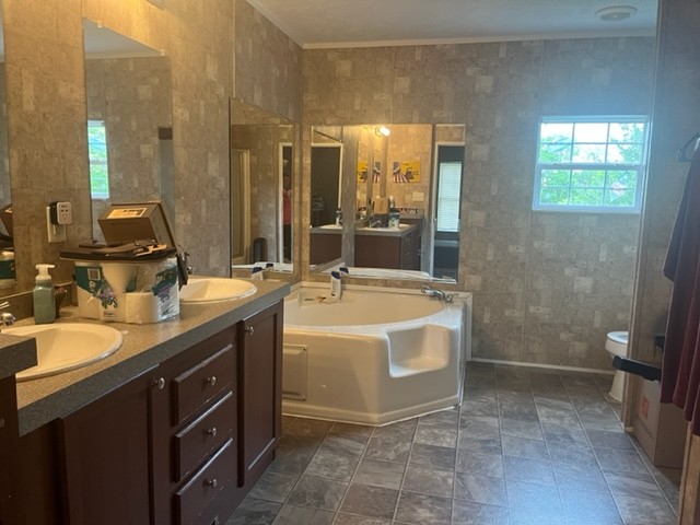 168 Liberty Road Winchester, TN 37398 - Photo 6 of 13 a spacious bathroom with a tub sink and mirror