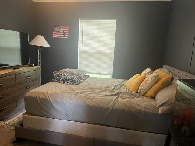 168 Liberty Road Winchester, TN 37398 - Photo 7 of 13 a bedroom with a bed and a lamp on dresser