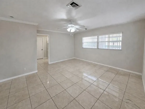 a view of an empty room with a window