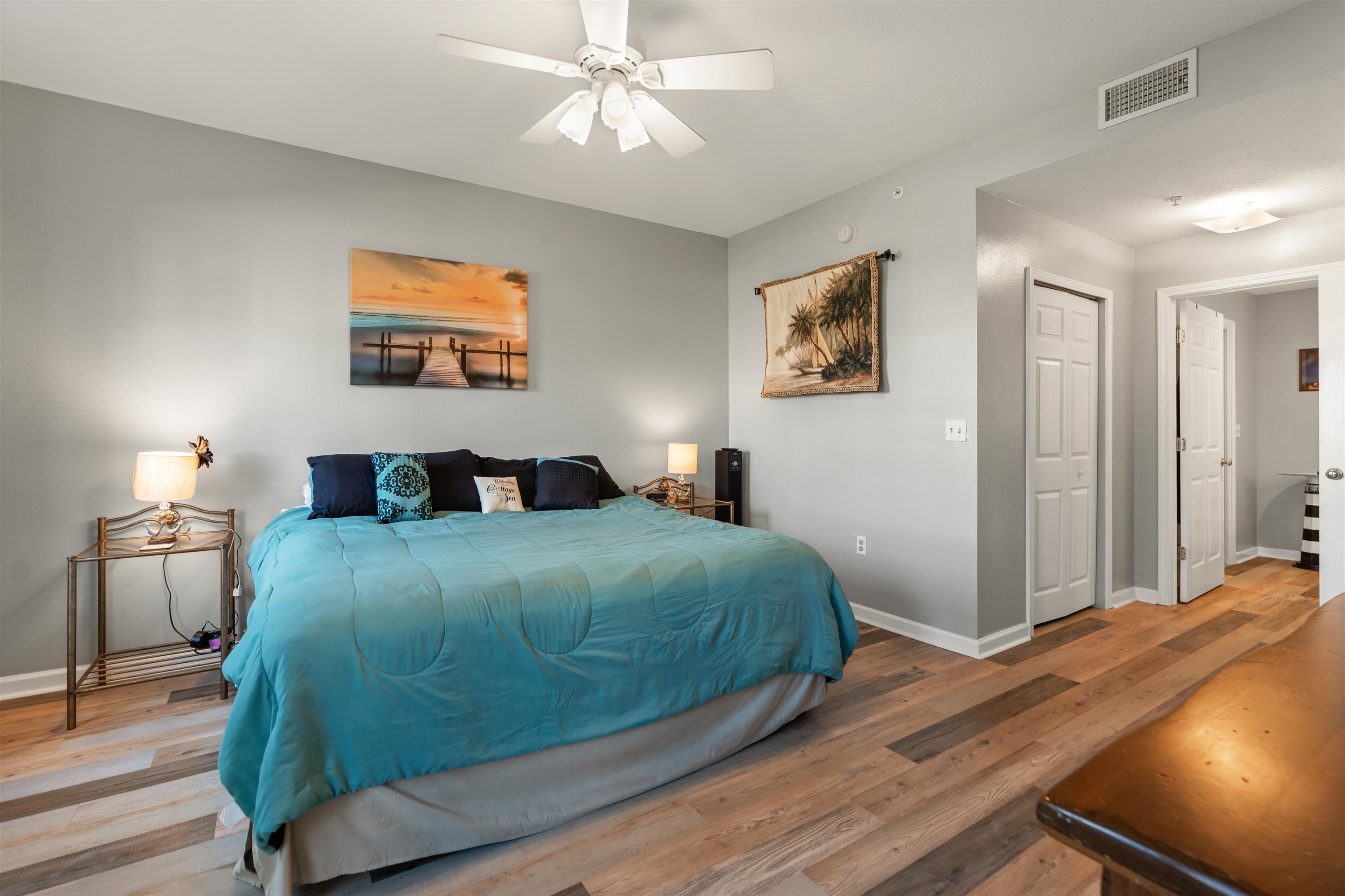 265 Atlantis Circle, Unit 102 St. Augustine Beach, FL 32080 - Photo 14 of 38 a bedroom with a bed and a chandelier