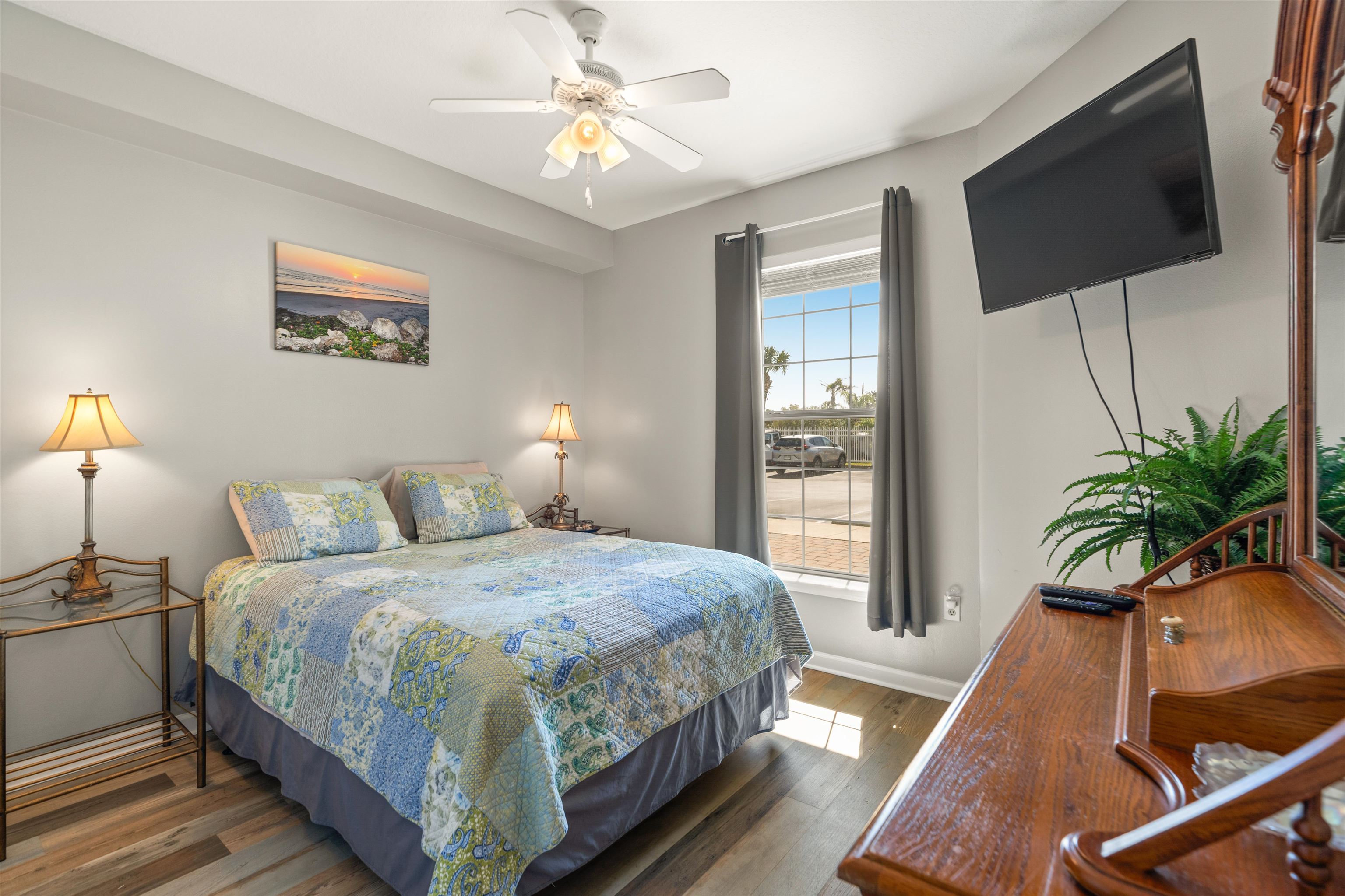 265 Atlantis Circle, Unit 102 St. Augustine Beach, FL 32080 - Photo 26 of 38 a bedroom with a bed and a flat screen tv