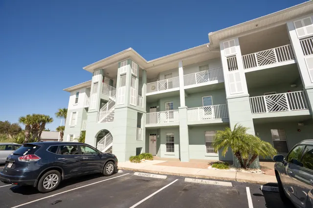 a view of a car parked in front of a building