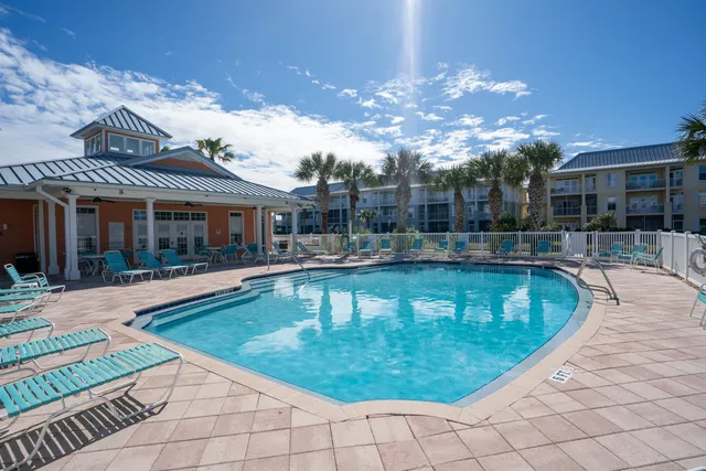 a view of a swimming pool with a patio