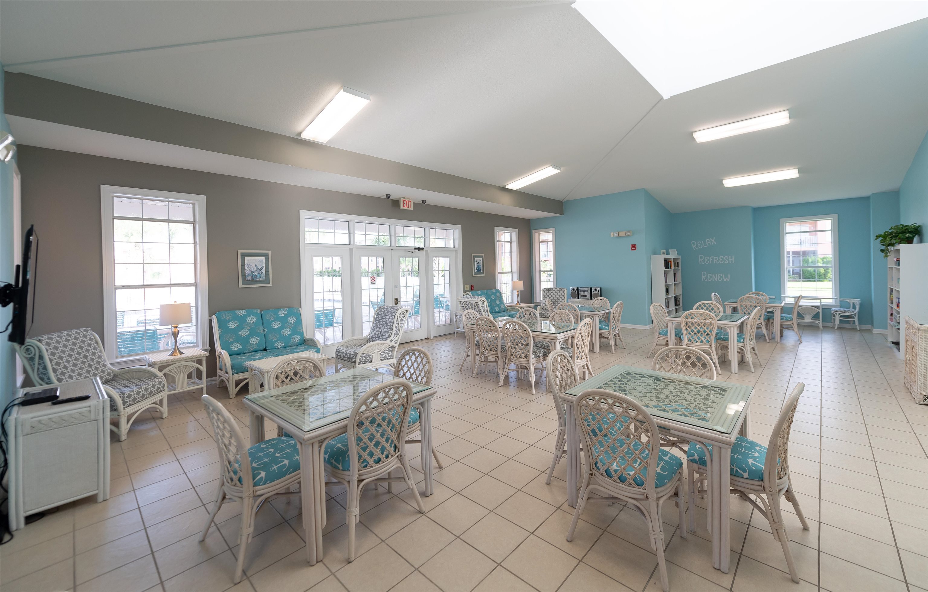 265 Atlantis Circle, Unit 102 St. Augustine Beach, FL 32080 - Photo 37 of 38 a view of a dining room with furniture a livingroom and chandelier