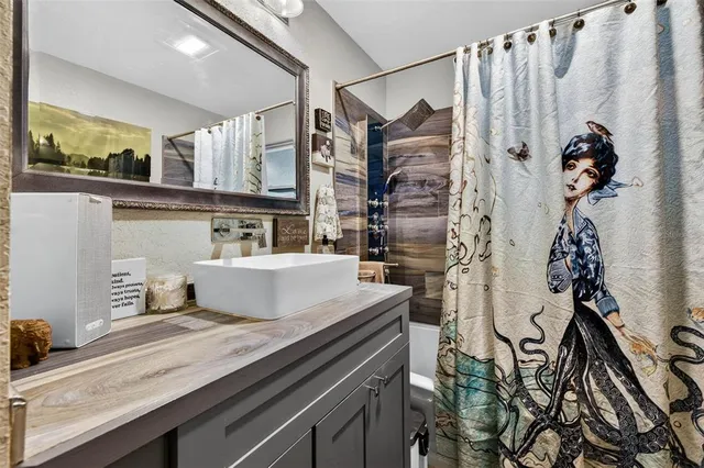 a bathroom with a sink and a mirror