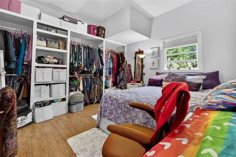 a living room with furniture a window and bookshelf