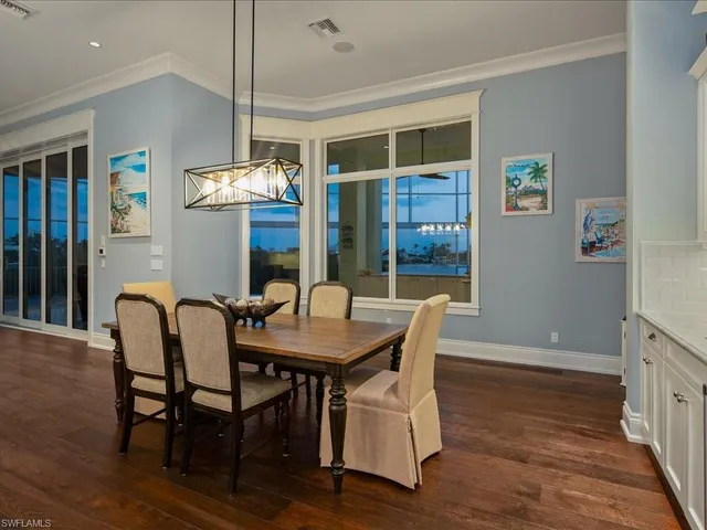 a view of a dining room with furniture and window
