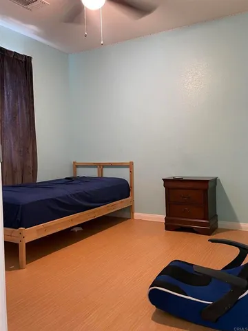 a room with a couch and a lamp