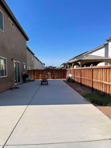 a front view of a building with a yard